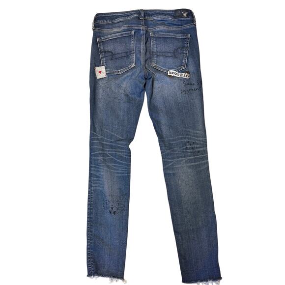American Eagle Distressed Skinny Jeans Patched Graphic Raw Hem - Picture 2 of 7
